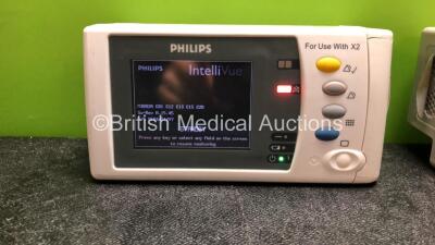 2 x Philips IntelliVue X2 Handheld Patient Monitors Including ECG, SpO2, NBP, Press and Temp Options with 2 x Philips M4607A Batteries (Both Power Up, Both with Damaged and 1 Flat Battery-See Photos) - 2