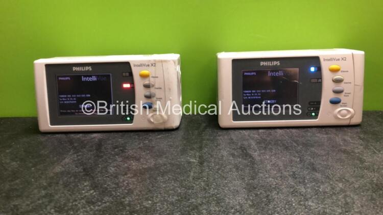 2 x Philips IntelliVue X2 Handheld Portable Patient Monitors Including ECG, SpO2, NBP, Press and Temp Options (Both Power Up when tested with Stock Batteries-Batteries Not Included) *SN DE315F0144, DE03796929*