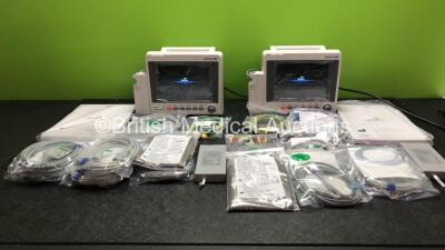 2 x EDAN iM50 Touch Screen Patient Monitors Including ECG, SpO2, NIBP, IBP1, IBP2, T1, T2 and CO2 Module Holder Options *Mfd 2020* with 2 x Batteries, 2 x BP Hoses, 2 x BP Cuff, 2 x IBP Pressure Transducers, 2 x SpO2 Sensors, 2 x CO2 Sampling Lines, 2 x A