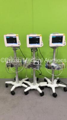 3 x Philips IntelliVue MP20 Patient Monitors on Stand with 3 x Philips M300A Multiparameter Modules with Press/Temp, NBP, SPO2 and ECG/Resp Options and Selection of Cables (All Power Up) *S/N DE72842765 / DE72842771 / DE72842801*