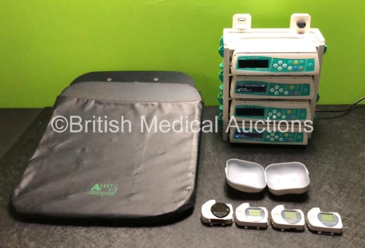 Mixed Lot Including 4 x B Braun Infusomat Space Infusion Pumps (2 x Power Up with Battery Maintenance) with B.Braun Space Docking Station, 4 x Konica Minolta Pulsox Monitors and 1 x Anetic Aid Attachment