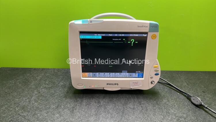 Philips IntelliVue MP50 Patient Monitor (Powers Up with Missing Dial-See Photo) 1 x Philips IntelliVue X2 Handheld Patient Monitor Including ECG, SpO2, NBP Press and Temp Options with 1 x Battery (Both Power Up) *C*