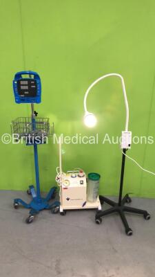 1 x Heine HL5000 Patient Examination Lamp on Stand (Powers Up with Good Bulb), 1 x Therapy Equipment Ltd Suction Pump (Powers Up) and 1 x GE Dinamap Procare Vital Signs Monitor on Stand (No Power - Missing Front Facia Plate - See Pictures) *S/N 1220000832