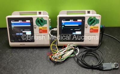 2 x Philips Heartstart XL+ Defibrillators with ECG and Printer Options Including 1 x 3 Lead ECG Lead and 1 x Paddle Lead (Both Power Up) *SN US61201776 / US61201773*