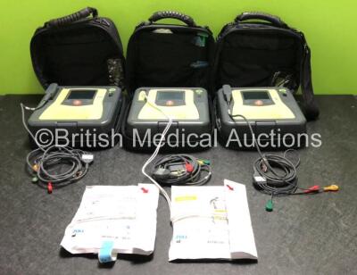 3 x Zoll AED PRO Defibrillators with 3 x Batteries, 3 x 3 Lead ECG Leads and 2 x Electrode Packs *1 x in Date, 1 x Out of Date* (All Power Up, 2 x Good Batteries, 1 x Flat Battery) *SN AA09C013171 / AA13C027863 / AA10C016705*