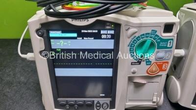 2 x Philips Heartstart MRx Defibrillator / Monitor Including , ECG, and Printer Options, with 2 x M3725A Test Load, 2 x Paddle Leads, 2 x Philips M3539A Module and 1 x Philips M1674A 3 Lead ECG Lead (Both Power Up) *SN US00686627 / US00576158* - 3