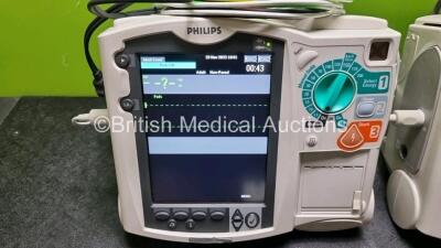 2 x Philips Heartstart MRx Defibrillator / Monitor Including , ECG, and Printer Options, with 2 x M3725A Test Load, 2 x Paddle Leads, 2 x Philips M3539A Module and 1 x Philips M1674A 3 Lead ECG Lead (Both Power Up) *SN US00581608 / US00581606* - 3