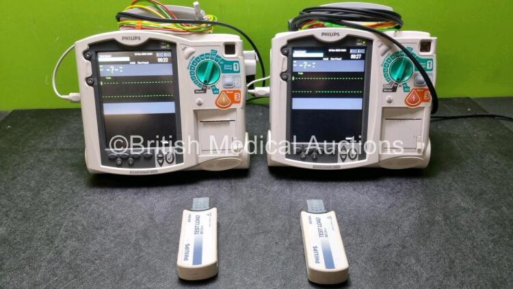 2 x Philips Heartstart MRx Defibrillator / Monitor Including , ECG, and Printer Options, with 2 x M3725A Test Load, 2 x Paddle Leads, 2 x Philips M3539A Module and 1 x Philips M1674A 3 Lead ECG Lead (Both Power Up) *SN US00586636 / US00599185*