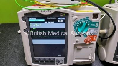 2 x Philips Heartstart MRx Defibrillator / Monitor Including , ECG, and Printer Options, with 2 x M3725A Test Load, 2 x Paddle Leads, 2 x Philips M3539A Module 1 x SpO2 Finger Sensor Connector and 1 x Philips M1674A 3 Lead ECG Lead (Both Power Up) *SN US0 - 2