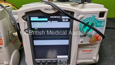 2 x Philips Heartstart MRx Defibrillator / Monitor Including , ECG, and Printer Options, with 2 x M3725A Test Load, 2 x Paddle Leads, 2 x Philips M3539A Module 1 x SpO2 Finger Sensor Connector and 1 x Philips M1674A 3 Lead ECG Lead (Both Power Up) *SN US0 - 3