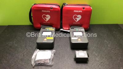 2 x Philips FR3 Heartstart Defibrillators in Carry Cases with 4 x Batteries (Both Power Up and Pass Self Test) *SN C17A-00058 / C12F-00345*