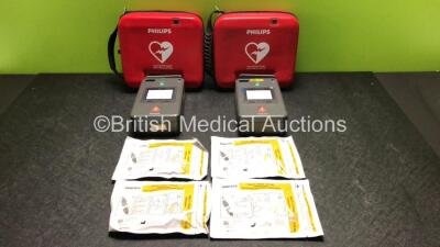 2 x Philips FR3 Heartstart Defibrillators in Carry Cases with 2 x Batteries and 4 x Electrode Packs *All Expire 2023* (Both Power Up and Pass Self Test) *SN C18H-00134 / C11I-00423*