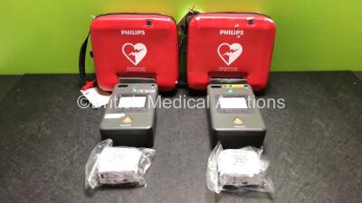 2 x Philips FR3 Heartstart Defibrillators in Carry Cases with 4 x Batteries (Both Power Up and Pass Self Test) *SN C12F-00440 / C13F-00925*