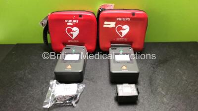 2 x Philips FR3 Heartstart Defibrillators in Carry Cases with 4 x Batteries (Both Power Up and Pass Self Test) *SN C14B-00526 / C13F-00915*