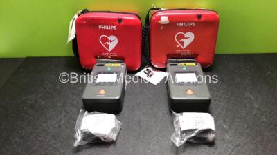 2 x Philips FR3 Heartstart Defibrillators in Carry Cases with 4 x Batteries (Both Power Up and Pass Self Test) *SN C12H-00026 / C12D-00035*