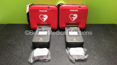 2 x Philips FR3 Heartstart Defibrillators in Carry Cases with 4 x Batteries (Both Power Up and Pass Self Test) *SN C13G-00707 / C13F-00934*