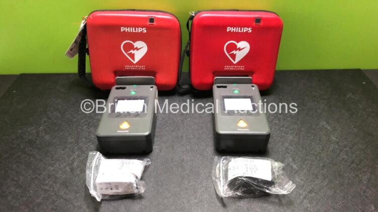 2 x Philips FR3 Heartstart Defibrillators in Carry Cases with 4 x Batteries (Both Power Up and Pass Self Test) *SN C14B-00530 / C16B-00077*