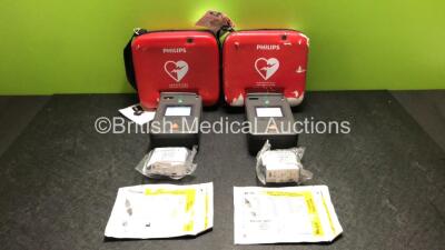 2 x Philips FR3 Heartstart Defibrillators in Carry Cases with 4 x Batteries and 2 x Philips Electrode Packs *Both Expire 2023* (Both Power Up and Pass Self Test) *SN C12L-00170 / C12L-00096*