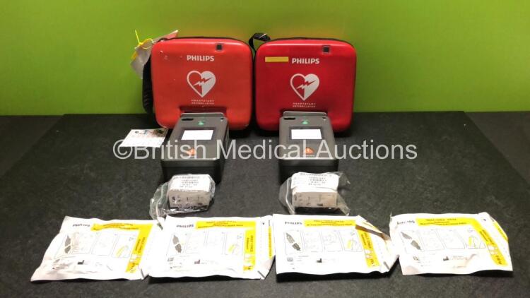 2 x Philips FR3 Heartstart Defibrillators in Carry Cases with 4 x Batteries and 4 x Electrode Packs *All Expired 2022* (Both Power Up and Pass Self Test) *SN C12K-00301 / C17A-00152*