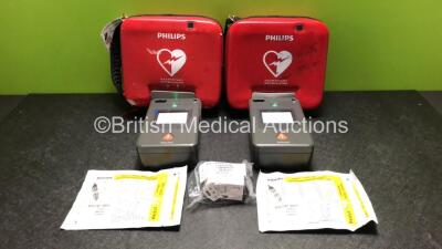 2 x Philips FR3 Heartstart Defibrillators in Carry Cases with 3 x Batteries and 2 x Electrode Packs *Both Expire 2023* (Both Power Up and Pass Self Test) *SN C13F-00918 / C12L-00262*