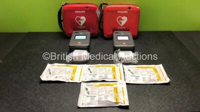 2 x Philips FR3 Heartstart Defibrillators in Carry Cases with 4 x Batteries and 4 x Electrode Packs *2 x Expire 2023, 2 x Expire 2024* (Both Power Up and Pass Self Test) *SN C17A-00150 / C13F-00924*