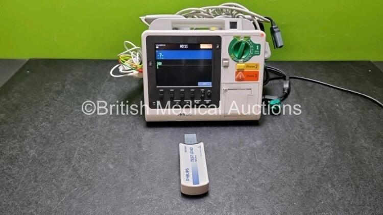 Philips Heartstart XL+ Defibrillator Including PACER, ECG and Printer Options with 1 External x Hard Paddle , 1 x MM3725A Test Load, 1 x Philips M1674A 3 Lead ECG Lead, 1 x Philips Battery Ref 989803167281 and 1 x Paddle Lead (Powers Up) *SN USD1309038*