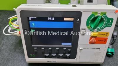 Philips Heartstart XL+ Defibrillator Including PACER, ECG and Printer Options with 1 External x Hard Paddle , 1 x MM3725A Test Load, 1 x Philips M1674A 3 Lead ECG Lead, 1 x Philips Battery Ref 989803167281 and 1 x Paddle Lead (Powers Up) *SN USD1309038* - 3