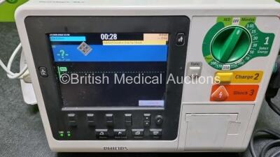 Philips Heartstart XL+ Defibrillator Including PACER, ECG and Printer Options with 1 x External Hard Paddle , 1 x MM3725A Test Load (Damage to Connector - See Photo), 1 x Philips M1674A 3 Lead ECG Lead, 1 x Philips Battery Ref 989803167281 and 1 x Paddle - 2