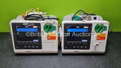 2 x Philips Heartstart XL+ Defibrillators Including PACER, ECG and Printer Options with 2 x Philips M1674A 3 Lead ECG LeadS, 2 x Philips Battery Ref 989803167281 and 2 x Paddle Lead (Both Power Up 1 x with Slight Crack in Casing - See Photo) *SN US4141219