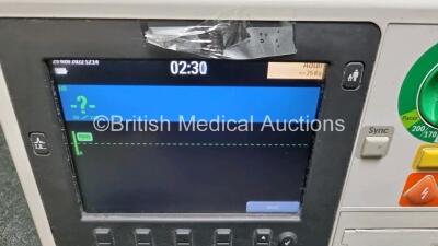 2 x Philips Heartstart XL+ Defibrillators Including PACER, ECG and Printer Options with 2 x Philips M1674A 3 Lead ECG LeadS, 2 x Philips Battery Ref 989803167281 and 2 x Paddle Lead (Both Power Up 1 x with Slight Crack in Casing - See Photo) *SN US4141219 - 3