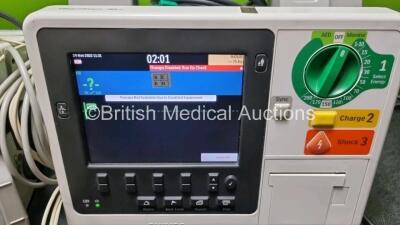 2 x Philips Heartstart XL+ Defibrillators Including , ECG and Printer Options with 2 x Philips M1674A 3 Lead ECG Lead, 1 x Philips Battery Ref 989803167281 and 2 x Paddle Lead (Both Power Up) *SN USD1309137 / US11409767* - 3