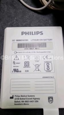 2 x Philips Heartstart XL+ Defibrillators Including , ECG and Printer Options with 2 x Philips M1674A 3 Lead ECG Lead, 1 x Philips Battery Ref 989803167281 and 2 x Paddle Lead (Both Power Up) *SN USD1309137 / US11409767* - 5