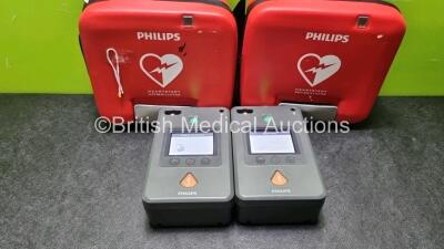 2 x Philips Heartstart FR3 Defibrillators In Carry Cases with 2 x Philips Heartstart Batteries Ref 989803150161 *Install Before 01-2027 / 03-2026* (Both Power Up) *SN C18G-00747 / C18G-00282*