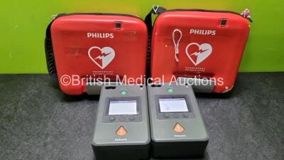 2 x Philips Heartstart FR3 Defibrillators In Carry Cases with 2 x Philips Heartstart Batteries Ref 989803150161 *Install Before 05-2027* (Both Power Up) *SN C14A00651 / C14A00108*