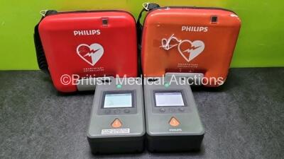 2 x Philips Heartstart FR3 Defibrillators In Carry Cases with 2 x Philips Heartstart Batteries Ref 989803150161 *Install Before 12-2024 / 10-2023* (Both Power Up) *SN C18G01500 / C14C00406*