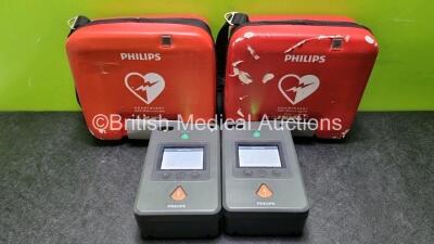 2 x Philips Heartstart FR3 Defibrillators In Carry Cases with 2 x Philips Heartstart Batteries Ref 989803150161 *Install Before 04-2027 / 12-2024* (Both Power Up) *SN C14C00278 / C14A00112*