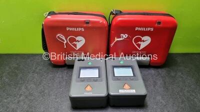 2 x Philips Heartstart FR3 Defibrillators In Carry Cases with 2 x Philips Heartstart Batteries Ref 989803150161 *Install Before 01-2027 / 02-2024* (Both Power Up) *SN C14C00398 / C18G01217*