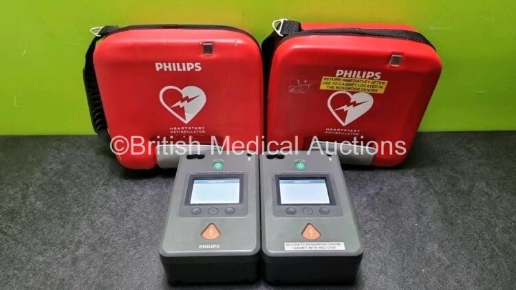 2 x Philips Heartstart FR3 Defibrillators In Carry Cases with 2 x Philips Heartstart Batteries Ref 989803150161 *Install Before 05-2027 / 04-2027* (Both Power Up) *SN C18G01588 . C18G01372*