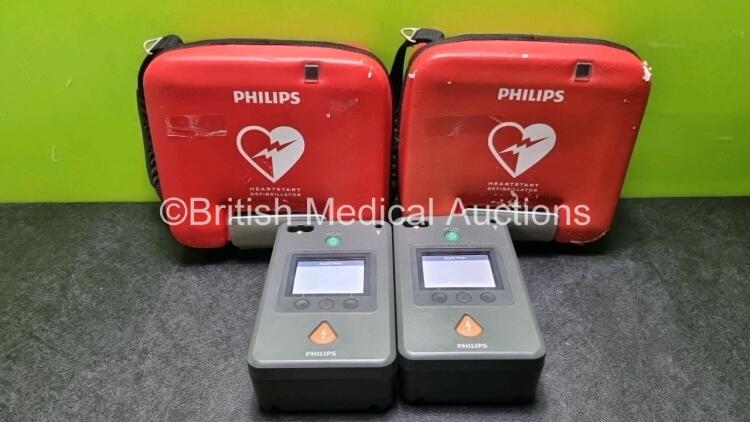 2 x Philips Heartstart FR3 Defibrillators In Carry Cases with 2 x Philips Heartstart Batteries Ref 989803150161 *Install Before 02-2024 / 04-2027* (Both Power Up) *SN C14C00438 / C14C00440*