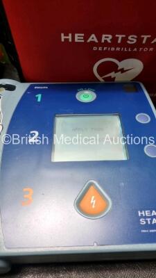 Job Lot Including 1 x Philips Heartstart FR3 Defibrillator In Carry Cases with 1 x Philips Heartstart Batteries Ref 989803150161 *Install Before 05-2027* and 1 x Philips Heartstart FR2+ Defibrillator with 1 x M386A Battery *Install Before 09-2023* SN C14 - 2