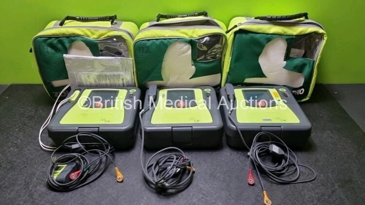 3 x Zoll AED PRO Defibrillators with 3 x Batteries, 3 x 3 Lead ECG Leads, 2 x Electrode Packs *Out of Date* (All Power Up 1 x with Scratching on Screen - See Photo) *SN AA10C016713 / AA10C016833 / AA08H11287*