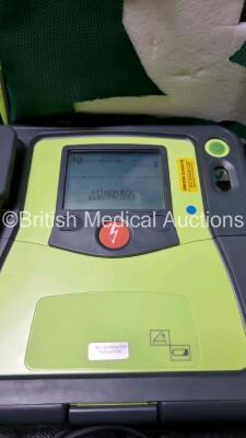 3 x Zoll AED PRO Defibrillators with 3 x Batteries, 3 x 3 Lead ECG Leads, 2 x Electrode Packs *Out of Date* (All Power Up 1 x with Scratching on Screen - See Photo) *SN AA10C016713 / AA10C016833 / AA08H11287* - 2