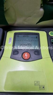 3 x Zoll AED PRO Defibrillators with 3 x Batteries, 3 x 3 Lead ECG Leads, 2 x Electrode Packs *Out of Date* (All Power Up 1 x with Scratching on Screen - See Photo) *SN AA10C016713 / AA10C016833 / AA08H11287* - 3