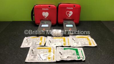 2 x Philips FR3 Heartstart Defibrillators in Carry Cases with 3 x Batteries and 5 x Electrode Packs *3 x Expire 2024, 1 x Expires 2023, 1 x Expired* (Both Power Up and Pass Self Test) *SN C13F-00919 / C18G-00952*