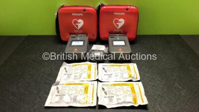 2 x Philips FR3 Heartstart Defibrillators in Carry Cases with 4 x Batteries and 4 x Electrode Packs *All Expire 2024* (Both Power Up and Pass Self Test) *SN C12L-00176 / C13F-00891*