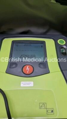 3 x Zoll AED PRO Defibrillators with 3 x Batteries, 1 x 3 Lead ECG Leads, 3 x Out of Date Electrode Packs (All Power Up Slight Scratches On Screen - See Photo) *SN AA10C016687 / AA110C016873 / AA06I003597* - 3