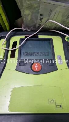 3 x Zoll AED PRO Defibrillators with 3 x Batteries, 3 x 3 Lead ECG Leads, 6 x Out of Date Electrode Packs (All Power Up) *SN AA09F0134926 / AA10C016644 / AA10C016871* - 2