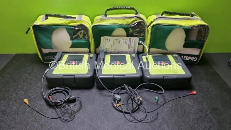 3 x Zoll AED PRO Defibrillators with 3 x Batteries, 2 x 3 Lead ECG Leads, 1 x Out of Date Electrode Pack (All Power Up) *SN AA07B005016 / AA10C016656 / AA09L015767*