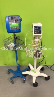 1 x Philips SureSigns VS2 Vital Signs Monitor on Stand and 1 x GE Dinamap Pro 300V2 VItal Signs Monitor on Stand (Both Power Up)