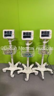 3 x Philips SureSigns VS3 Monitors on Stands (All Power Up) *CN2312079 / US12639808 / US12639806* (S)